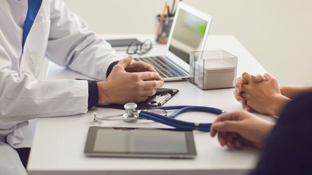 Physiotherapist discussing assessment findings with a patient
