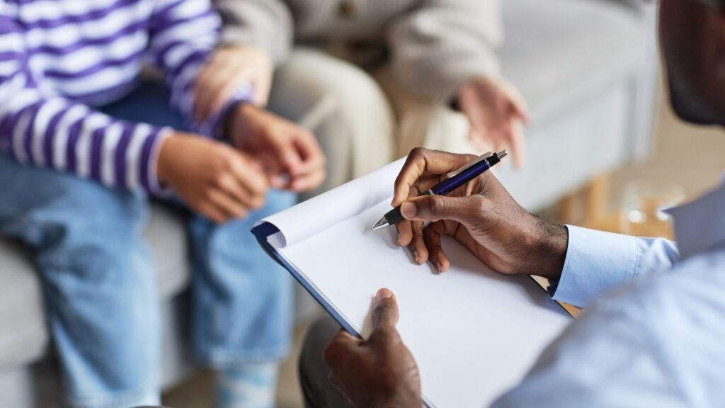 Physiotherapist documenting patient assessment notes in a notebook