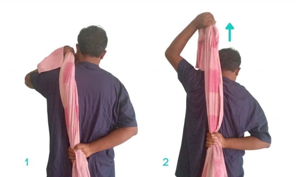 Stretching the shoulders using a towel