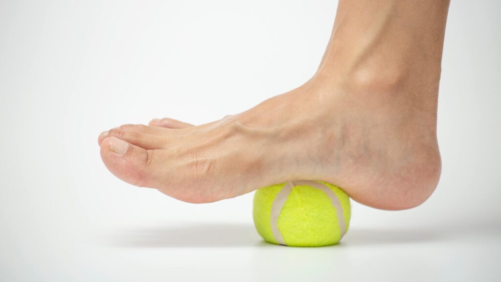 tennis ball self-massage for heel pain relief